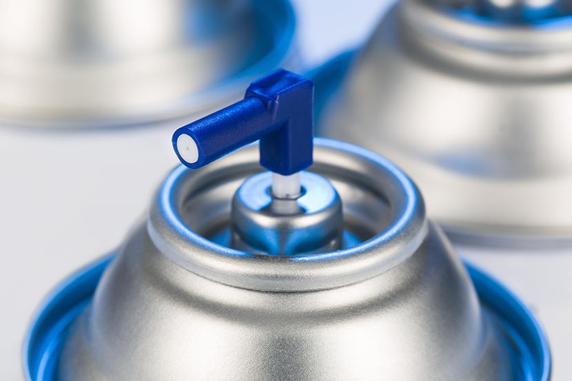 closeup of top of spray aerosol can nozzle